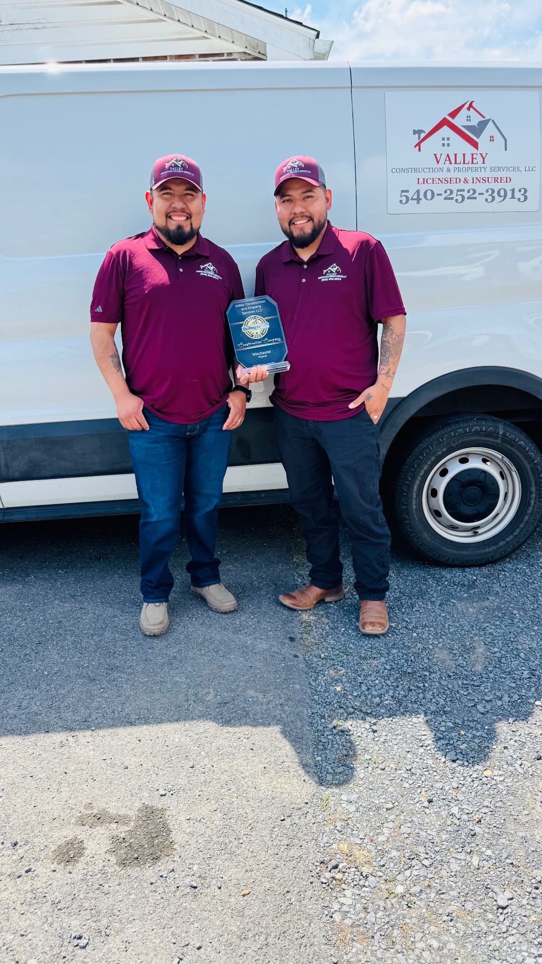 Owners of Valley Construction holding the Best of Business Winchester award
