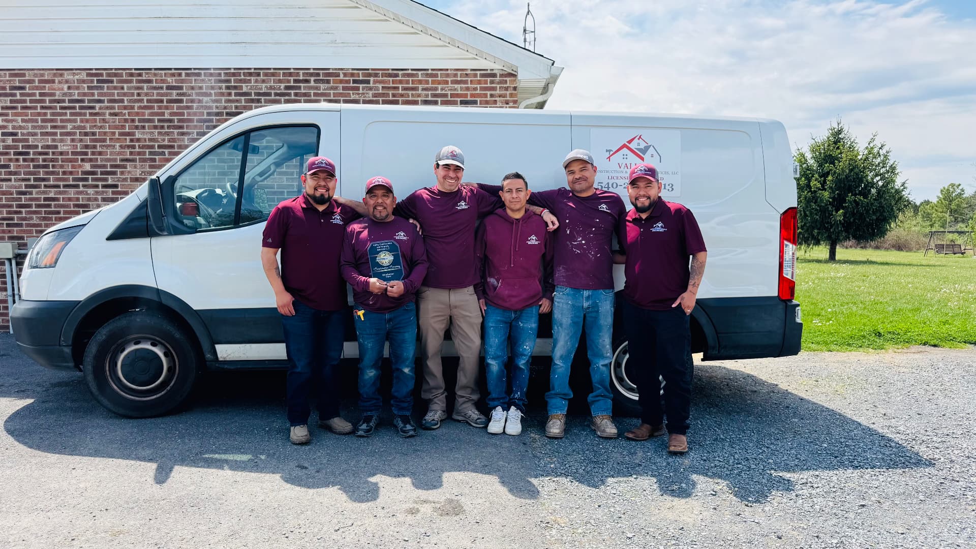 The Valley Construction & Property Services crew in front of the company van
